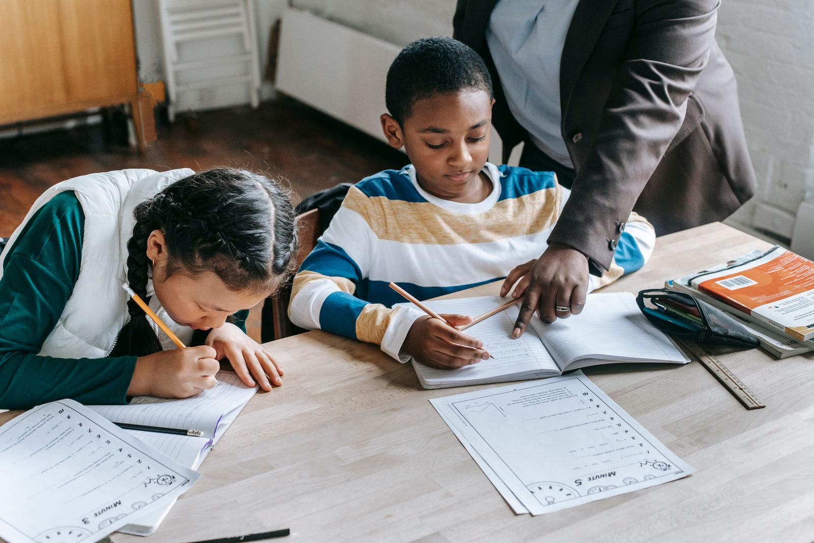 Teacher learning alongside a diverse group of children